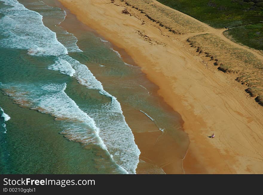 Loneley man on the Palm Beach in fall. NSW, Australia. Loneley man on the Palm Beach in fall. NSW, Australia