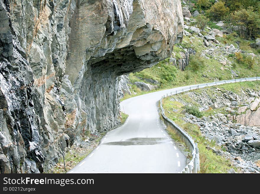 A cliff hanging over the road in Roan, Norway. A cliff hanging over the road in Roan, Norway.