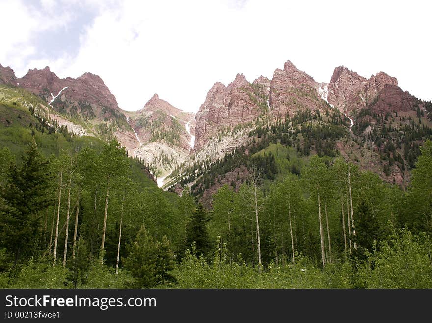 Red mountains with aspen trees at maroon belles,colorado. Red mountains with aspen trees at maroon belles,colorado