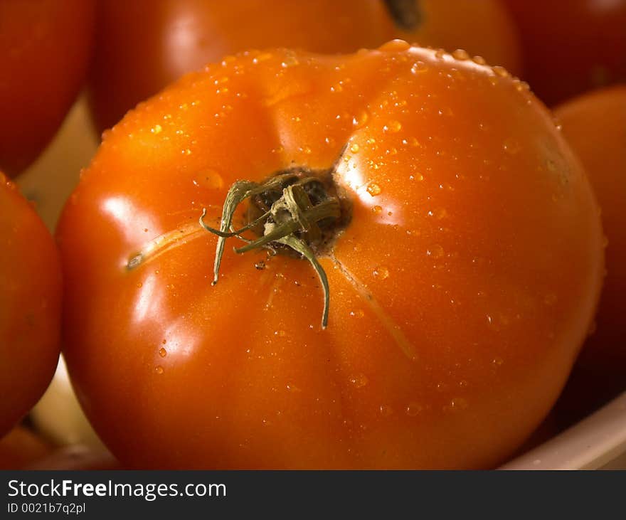 Closeup of a wet tomato,shallow dof. Closeup of a wet tomato,shallow dof