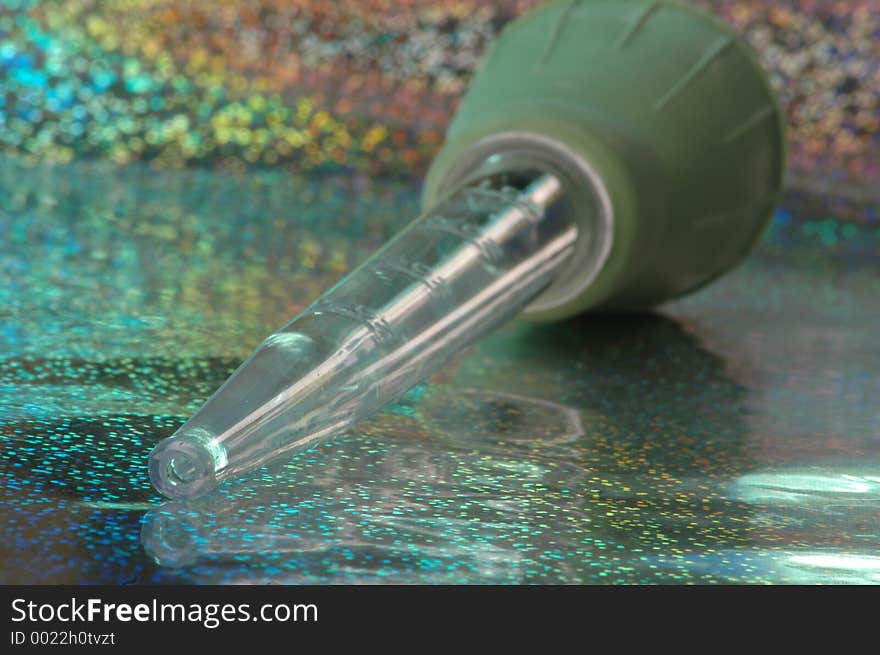 Turkey baster on aqua glitter background