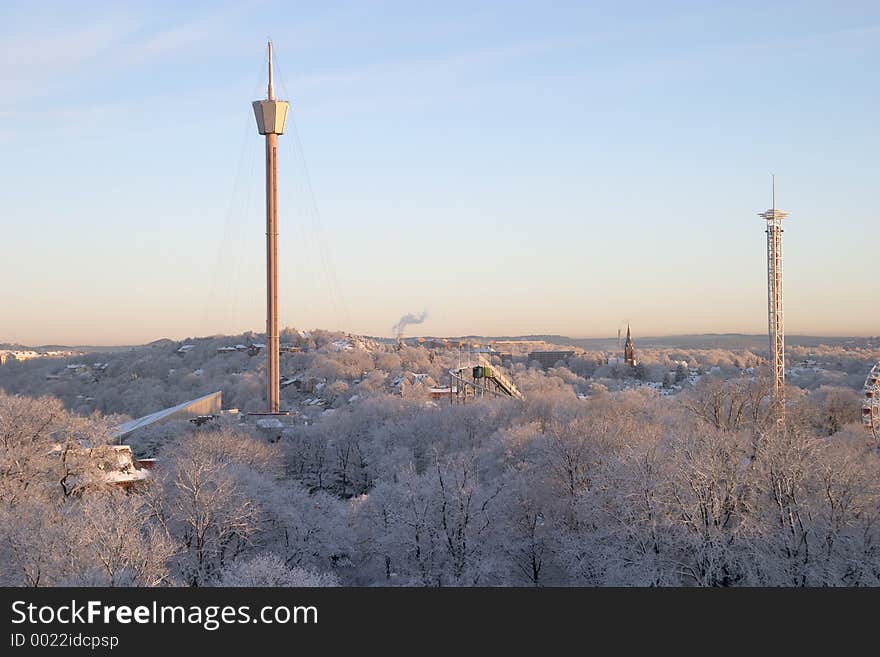 Winter morning: colourful, beautiful panorama sunrise with snow and buildings, Liseberg tower, downtown G�teborg, Sweden