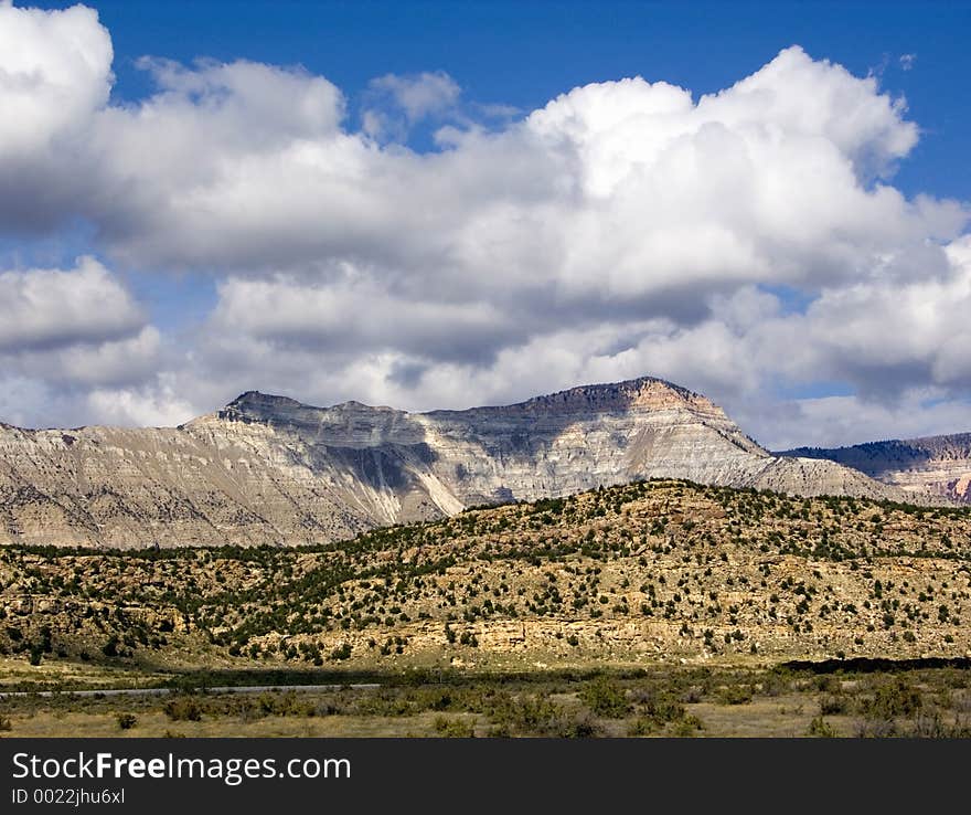 An imposing natural formation with steep-sided peaks, Battlement Mesa, Colorado