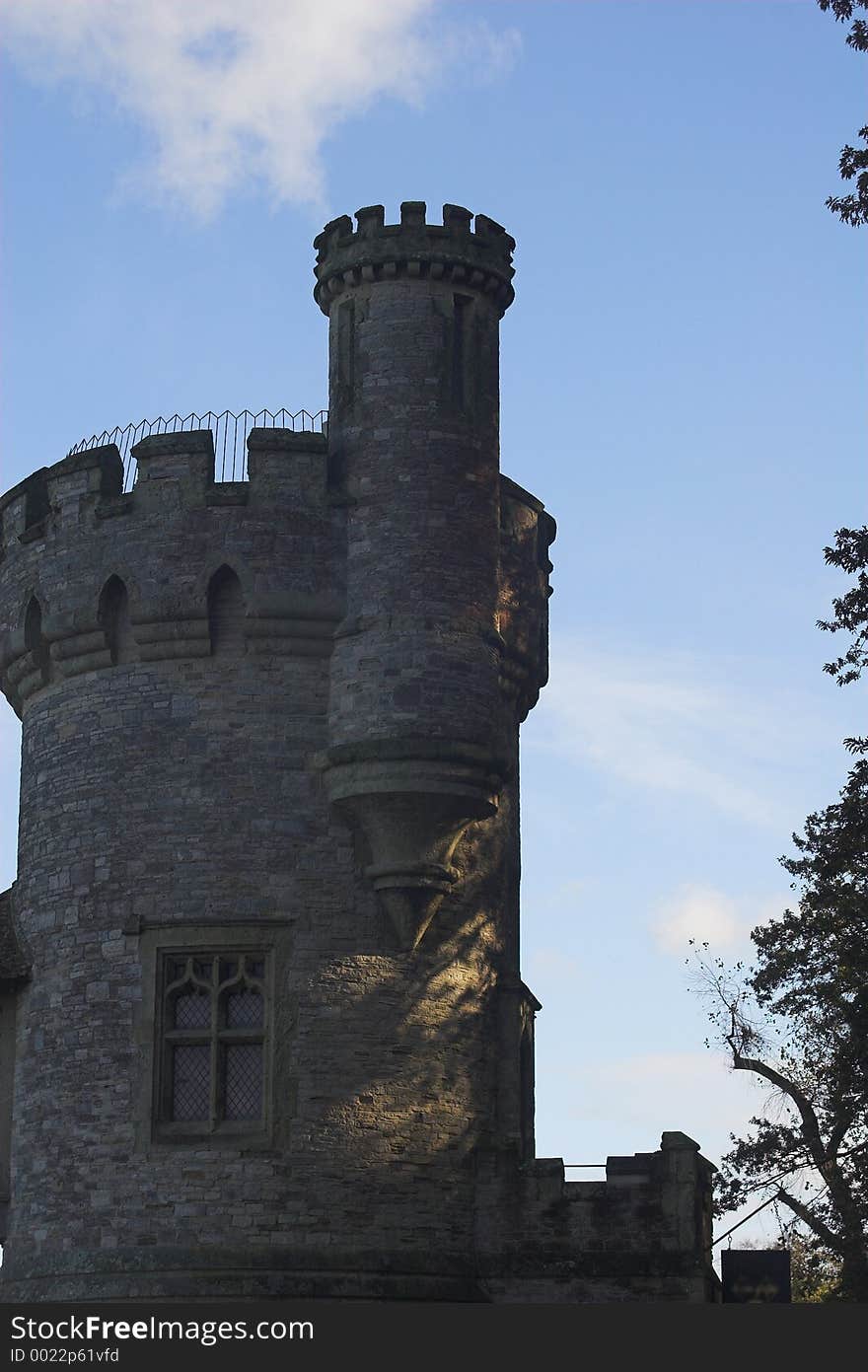 Stone built tower with blue sky in background. Stone built tower with blue sky in background