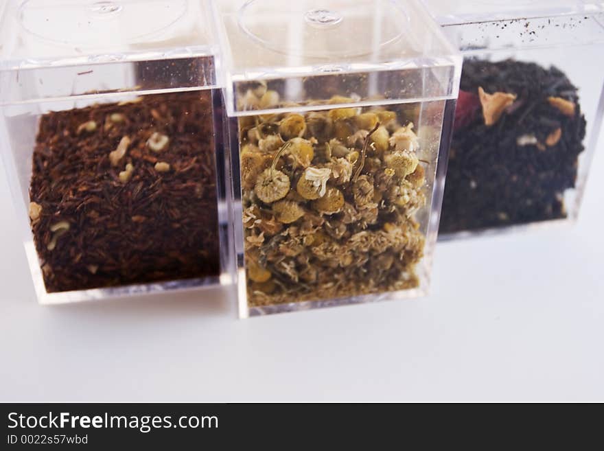 Plastic clear boxes of tea leaves. Plastic clear boxes of tea leaves