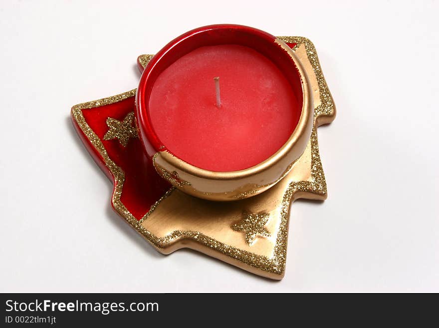 Red christmas candles on various christmas theme candleholders. Red christmas candles on various christmas theme candleholders.