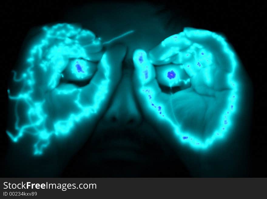 Man with glowing hands at his eyes. Man with glowing hands at his eyes