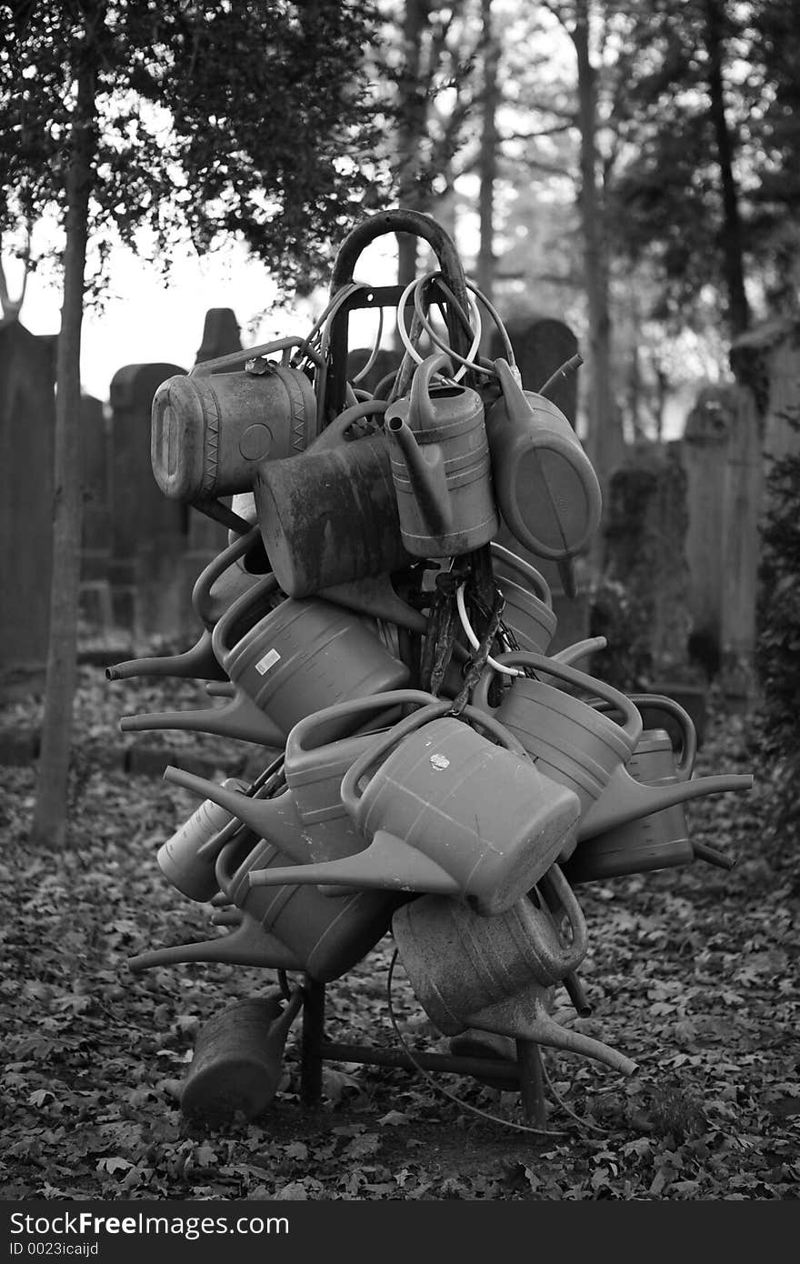 Watering cans on cemetery