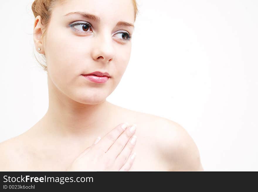 Girl preparing for a salon session with an expression of purity. Girl preparing for a salon session with an expression of purity