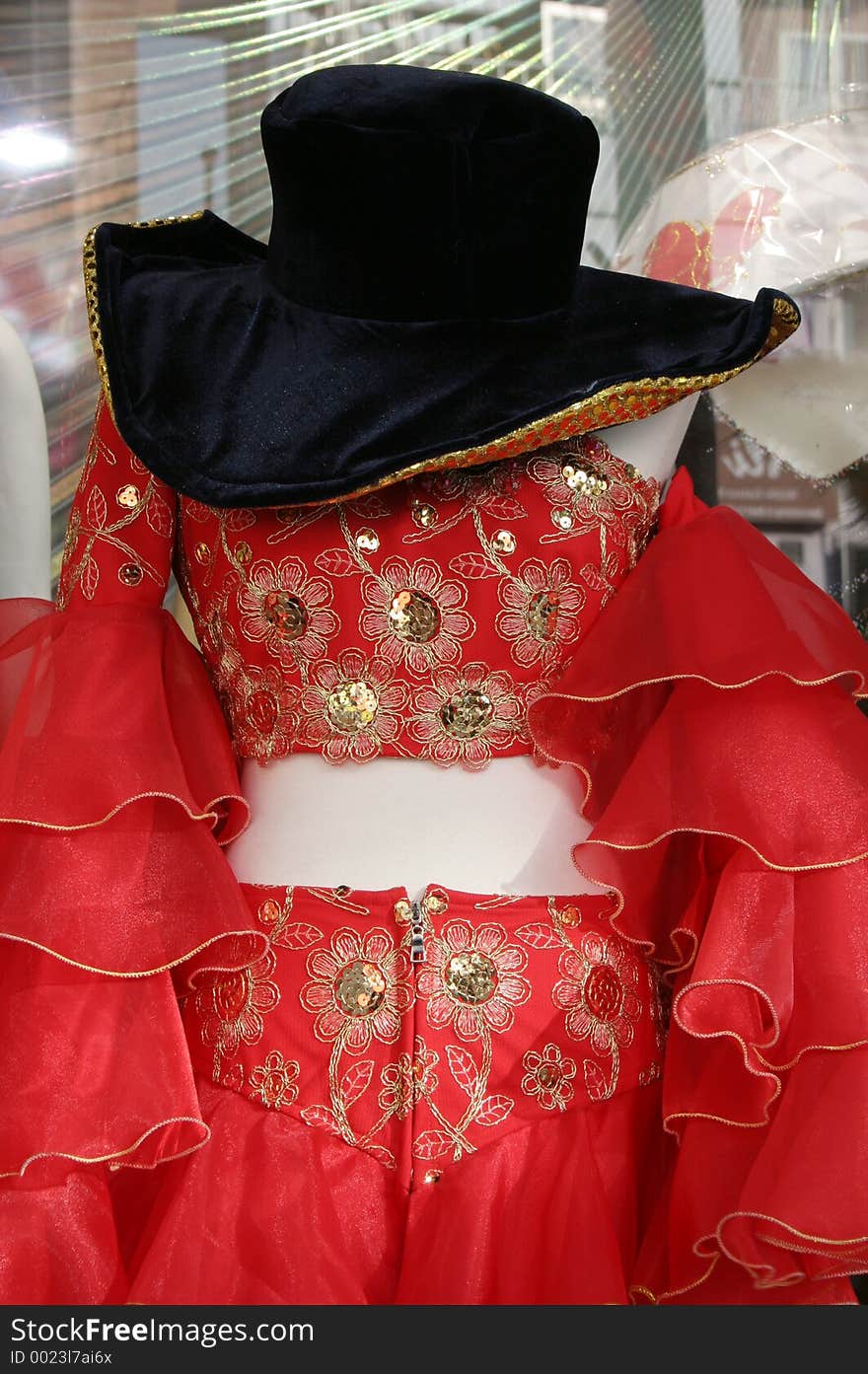 Red fancy dress costume with a black hat