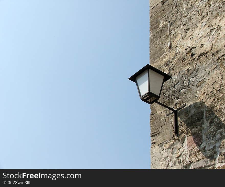 Lamp on the old wall