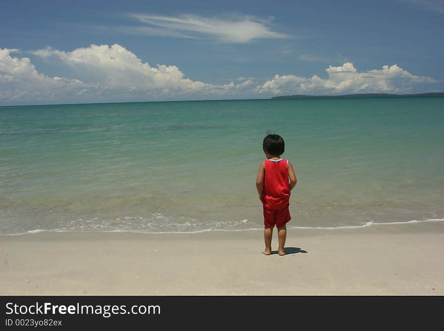 Lonely boy at beach. Lonely boy at beach