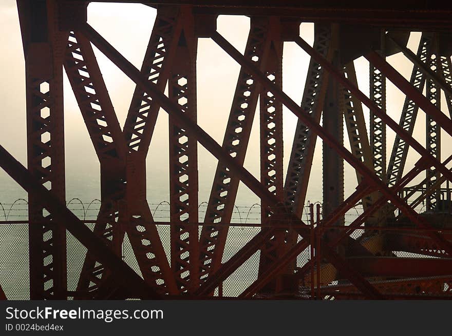 The view from underneath the Famous Golden Gate bridge in California enshrouded in the famous San Francisco fog. The view from underneath the Famous Golden Gate bridge in California enshrouded in the famous San Francisco fog.