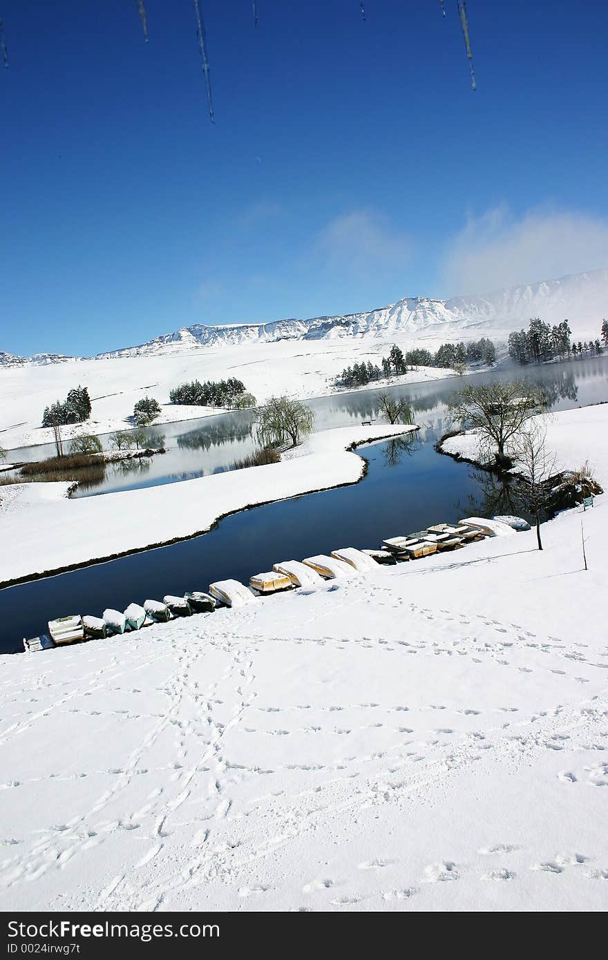 Snow covered lakeside landscape. Snow covered lakeside landscape