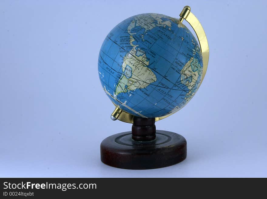 Old style world globe on blue background. Old style world globe on blue background