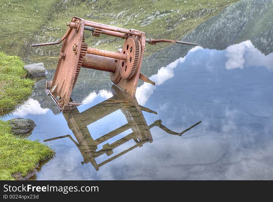 An old part of an old elevator, forgotten somewhere in the water. An old part of an old elevator, forgotten somewhere in the water