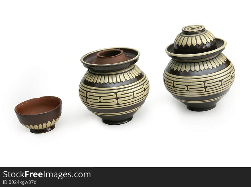 Earthen tea containers where the cap or top of the container can be used as a serving cup. Earthen tea containers where the cap or top of the container can be used as a serving cup