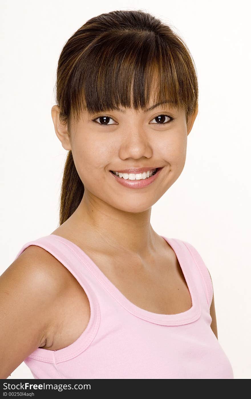 A cute young asian woman in a pink top on white. A cute young asian woman in a pink top on white