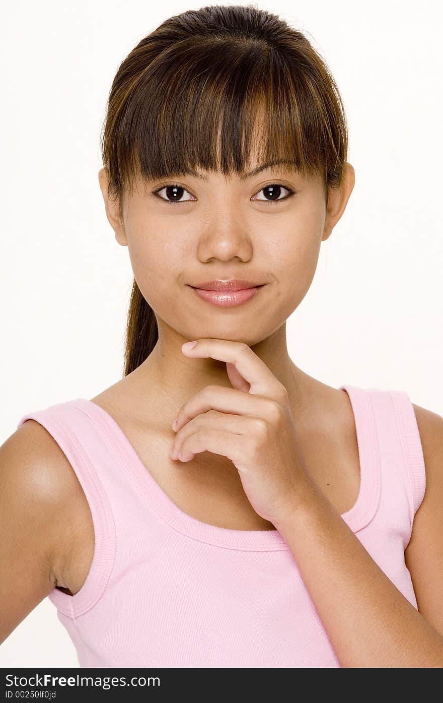 A pretty young asian woman in pink on white background. A pretty young asian woman in pink on white background