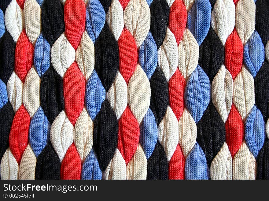 A colorful hand-made floor mat.