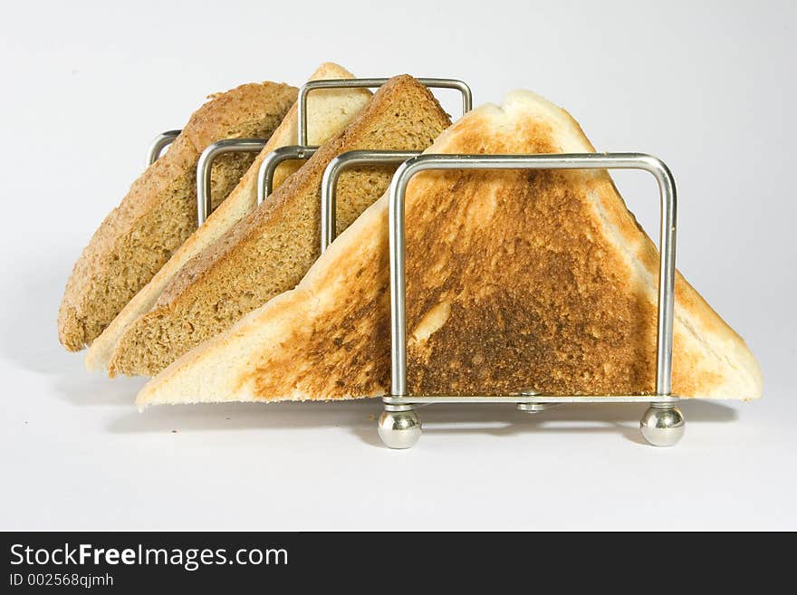 Mixed toast triangles in a rack. Mixed toast triangles in a rack