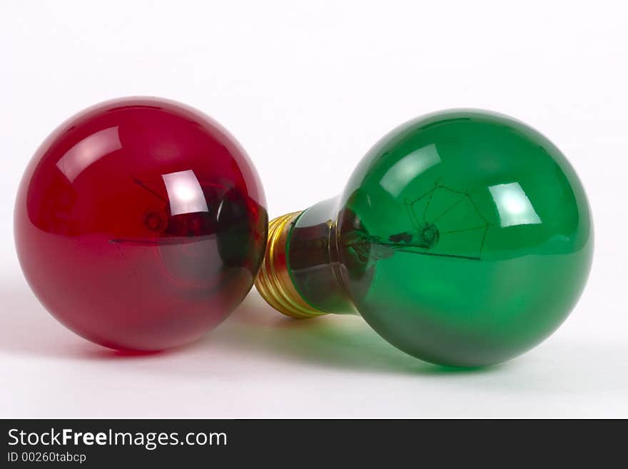 A pair of light bulbs - red and green. A pair of light bulbs - red and green