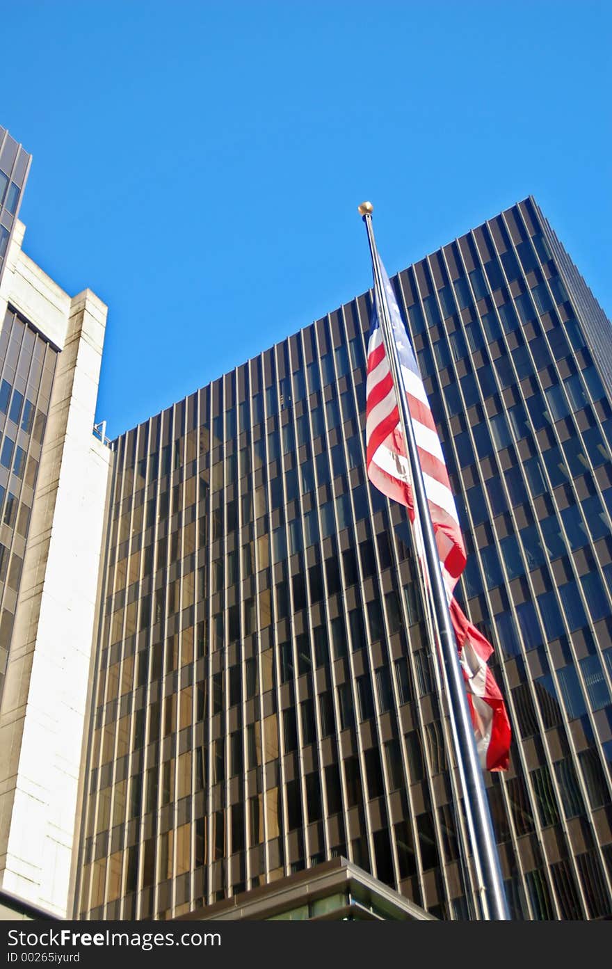 Flag in front of some corporate office buildings in downtown Sacramento, California. Flag in front of some corporate office buildings in downtown Sacramento, California