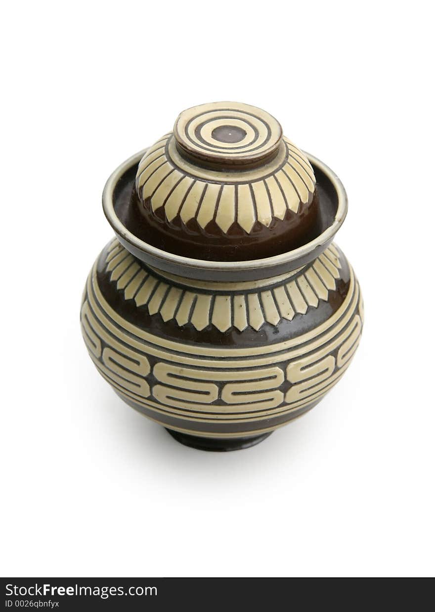 Earthen tea container where the cap or top of the container can be used as a serving cup. Earthen tea container where the cap or top of the container can be used as a serving cup