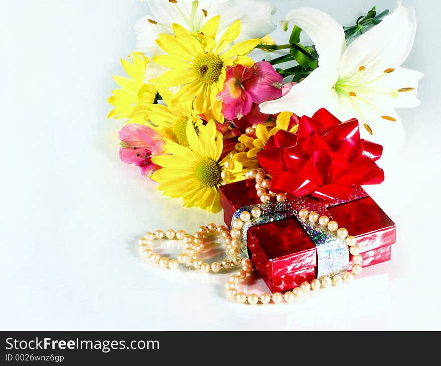 Present and flowers. Present and flowers