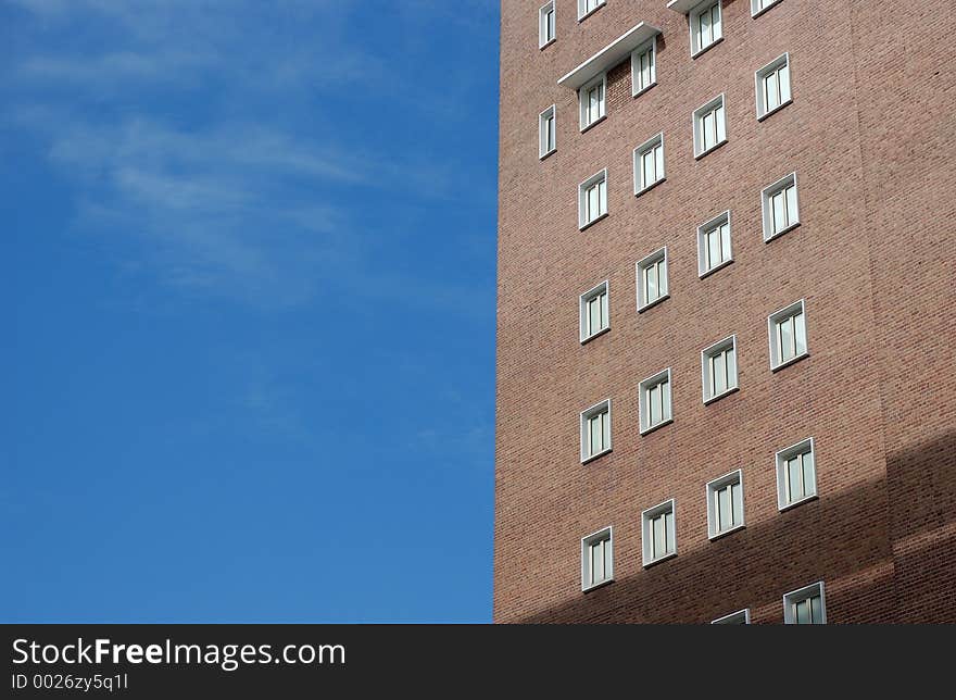 Red building on blue sky