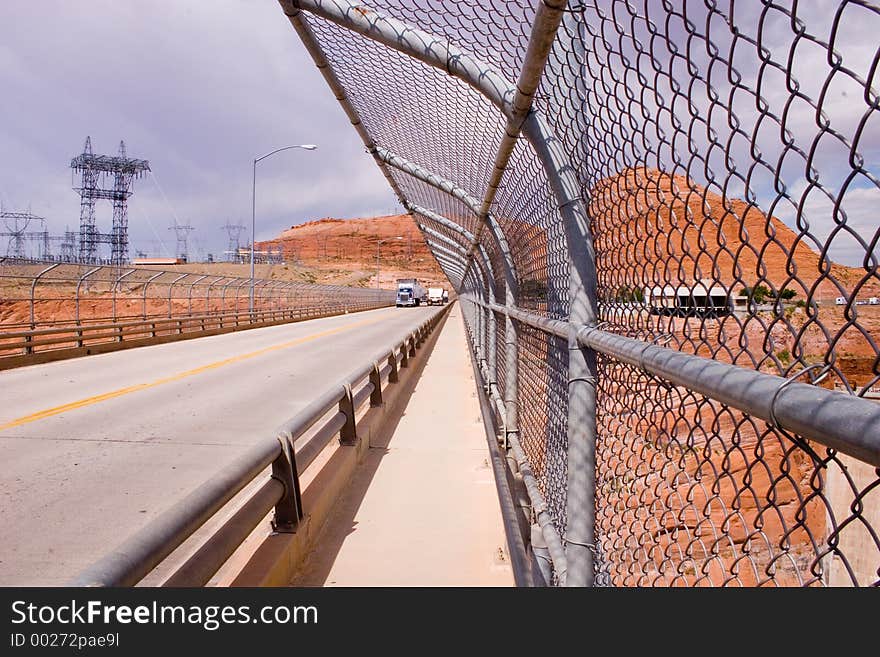 Bridge and linked fence next to the Glen Canyon Dam and Lake Powell in Arizona. Bridge and linked fence next to the Glen Canyon Dam and Lake Powell in Arizona.