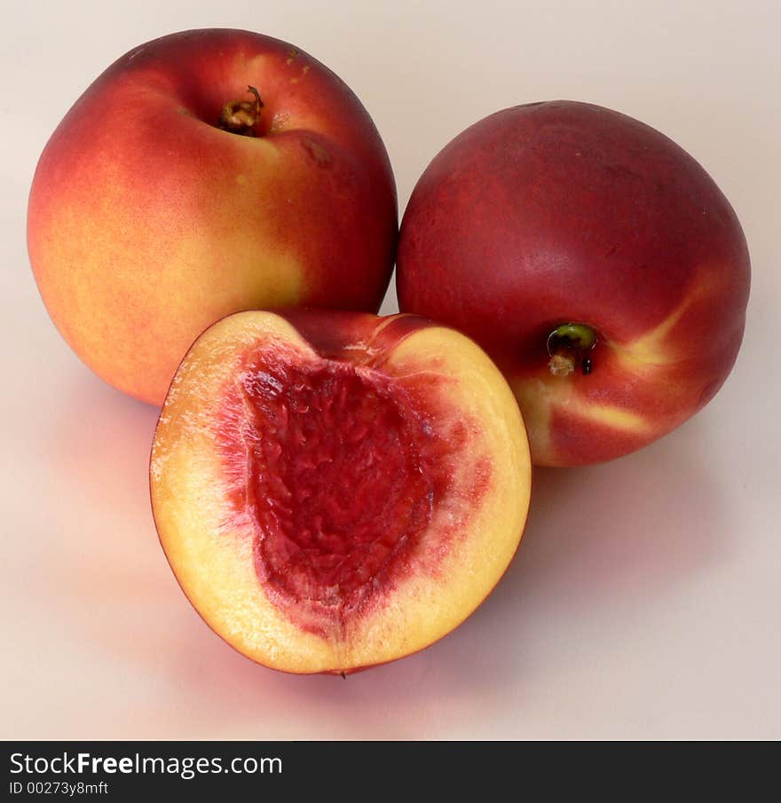 Studio shut of fresh peaches on wwhite background