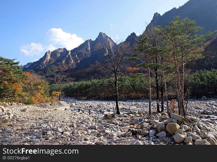 Dried up river bed with mountains in the background. Dried up river bed with mountains in the background