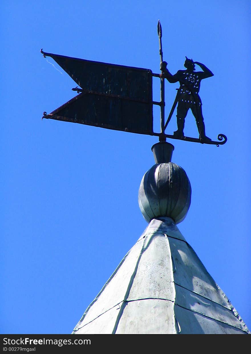 Windvane on a tower of an ancient fortress. Windvane on a tower of an ancient fortress