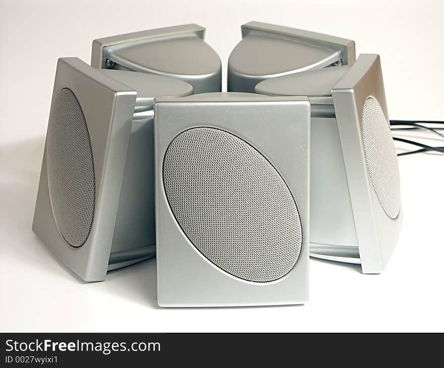 Five silver speakers