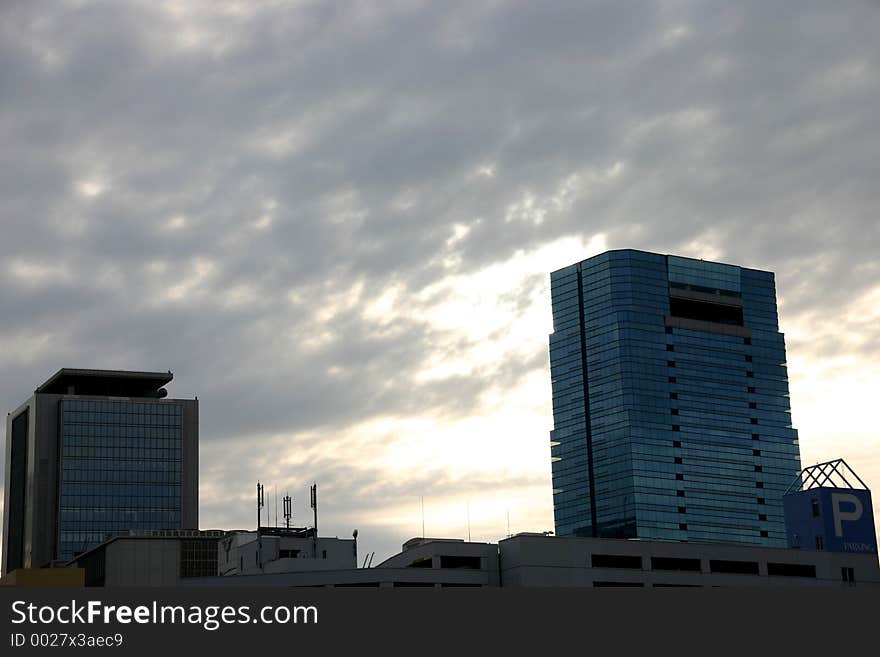 Modern architecture in japan; two towers in a cloudy day