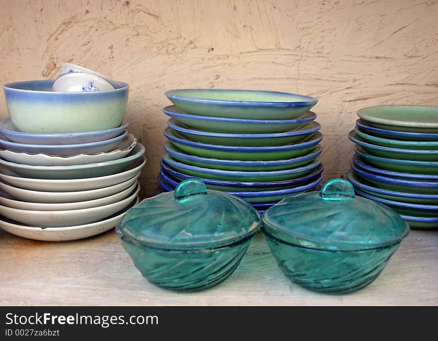 Piles of green and blue plates