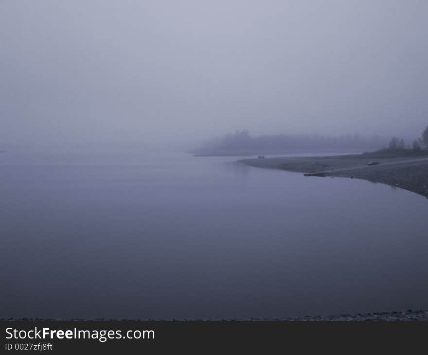 Calm misty reservoir on a cool Fall afternoon