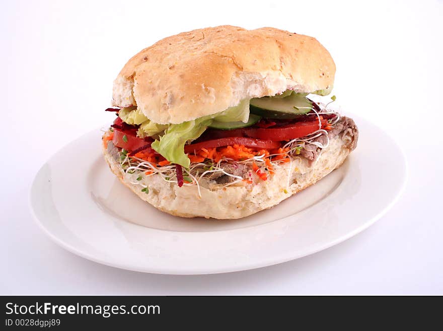 Fresh salad roll on a white plate and white background