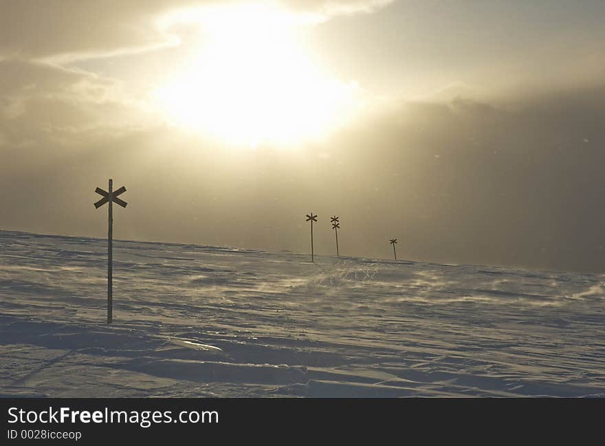 Crosses to sign the winter path on snowy mountains close to Valadalen, Jamtlands region, North Sweden. Crosses to sign the winter path on snowy mountains close to Valadalen, Jamtlands region, North Sweden