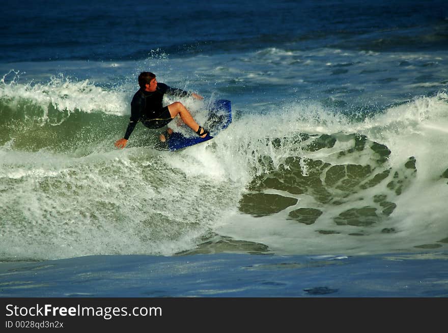 Bodyboarder ontop of a wave. Bodyboarder ontop of a wave