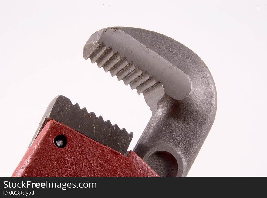 Horizontal view of a close up of a Monkey Wrench showing the teeth of the jaws on the upper part of the wrench. Horizontal view of a close up of a Monkey Wrench showing the teeth of the jaws on the upper part of the wrench