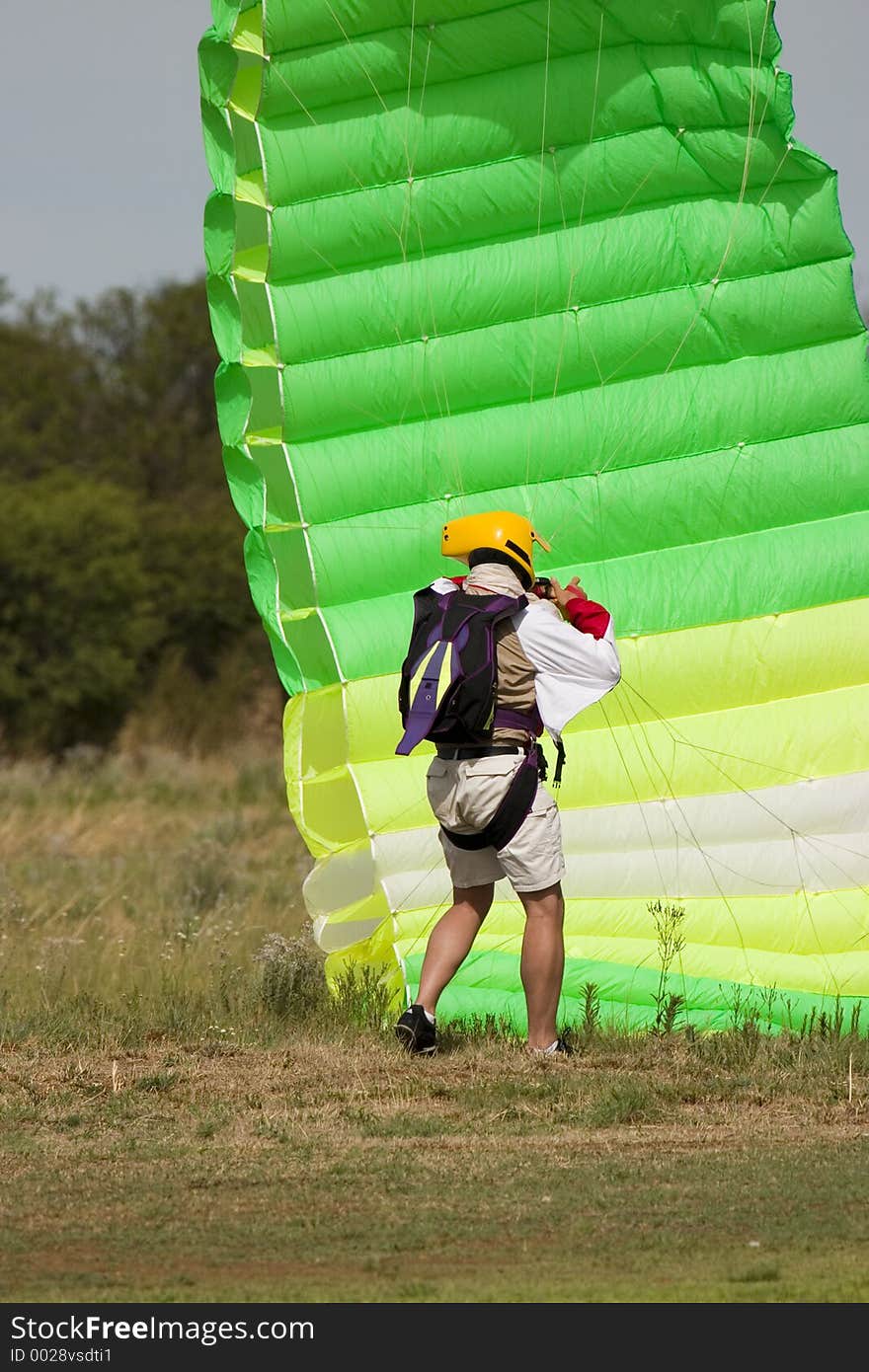 At end of skydive with green parachute