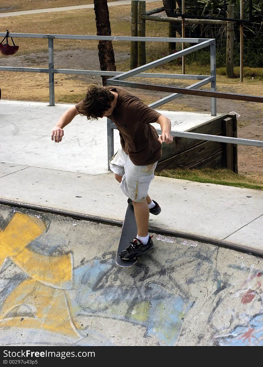 Boy at a skate park. Boy at a skate park.