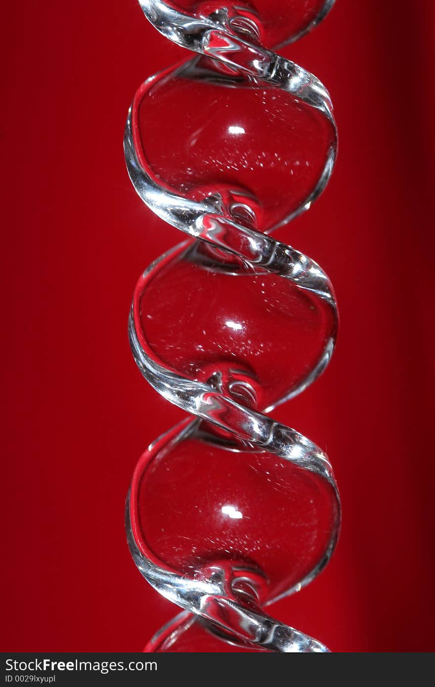 Macro of a glass ornament with red background. Macro of a glass ornament with red background