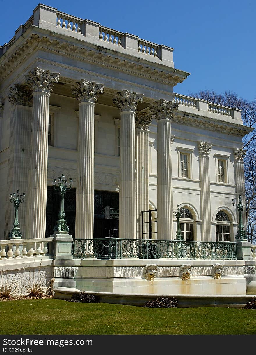 The front entrance of a large white mansion - Vertical Crop. The front entrance of a large white mansion - Vertical Crop