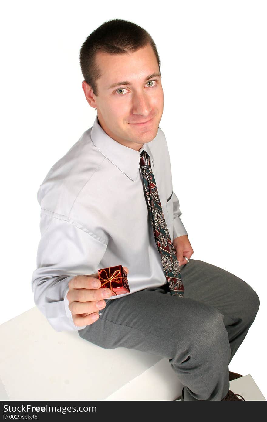 Man holding out a gift for you on white. Man holding out a gift for you on white