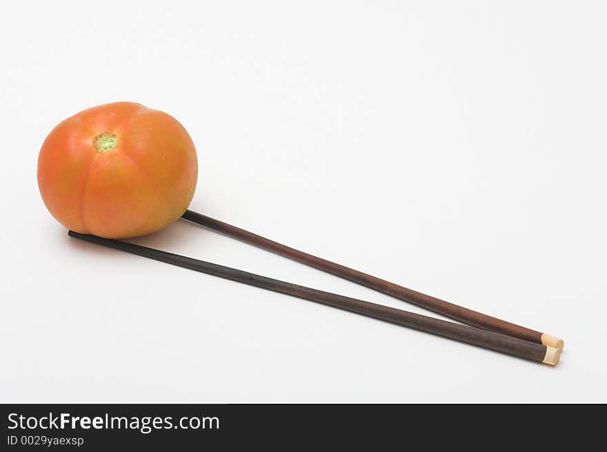 Tomato and chopsticks