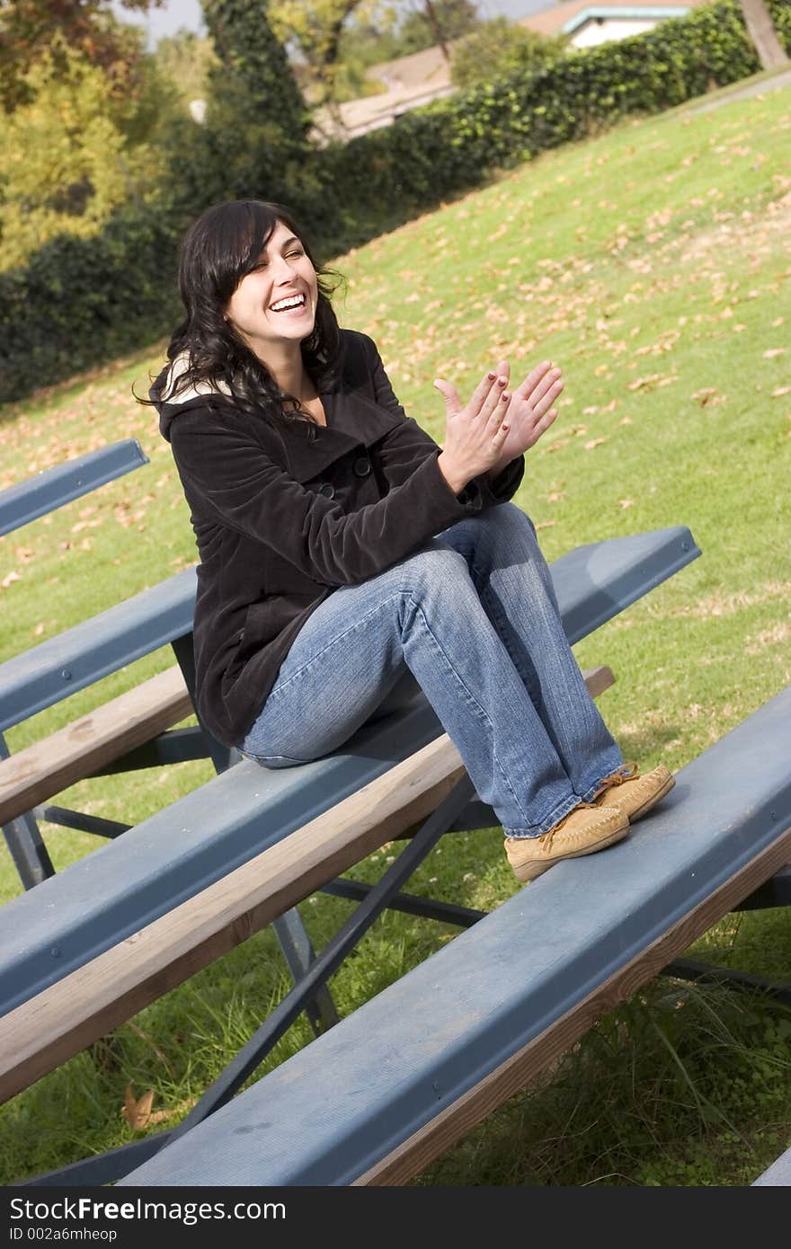 Woman on bleachers. Woman on bleachers