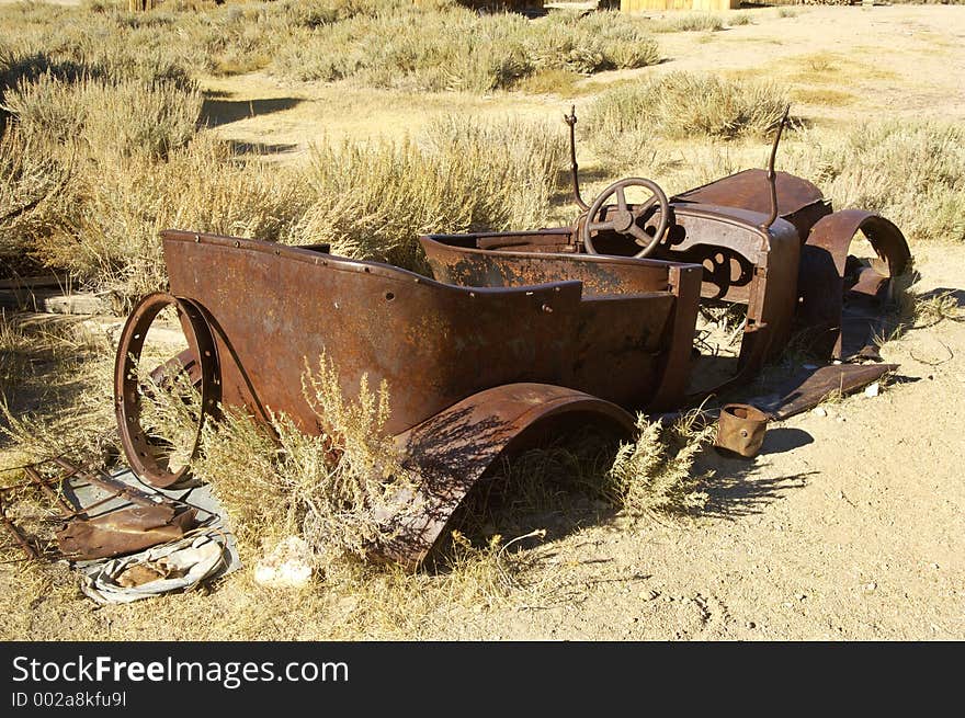 Rusty old car in a ghost town in California. Rusty old car in a ghost town in California.